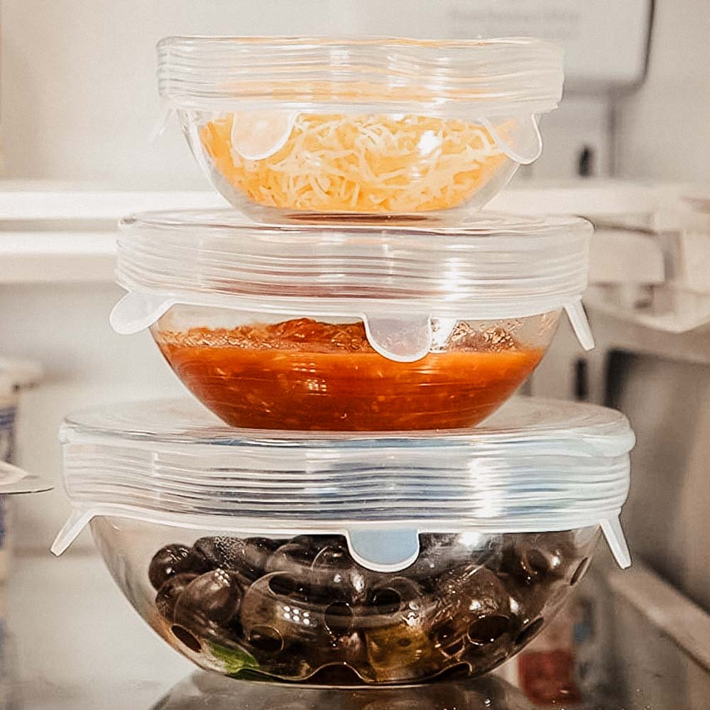 Picture of glass bowls with food covered with reusable silicon stretch lids.