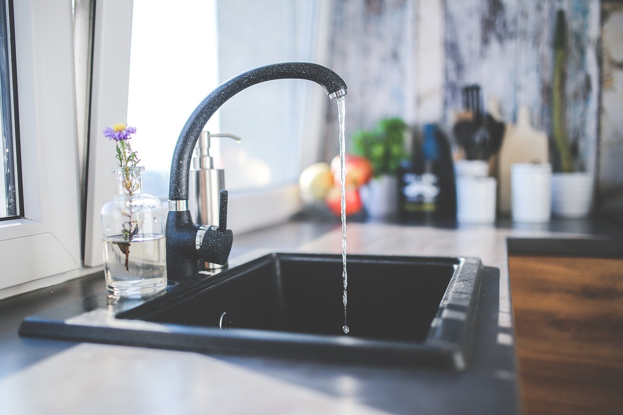 Water coming out of kitchen tap.