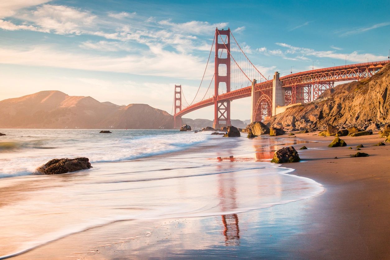 Golden Gate Bridge from low angles with beach in front