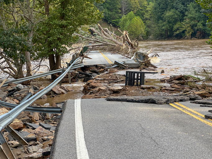 Washed out road and bridge in Virginia from heavy flooding 