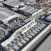An image of a modular battery storage facility in California. It looks like a series of lined-up white, rectangular containers.