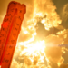 Red melting thermometer against the hot sun.